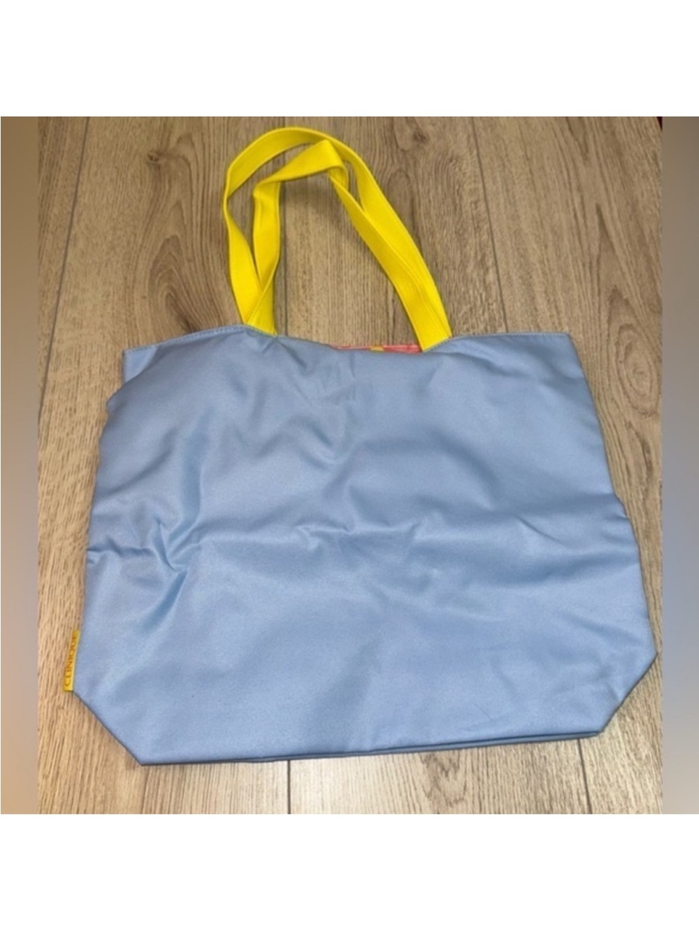 Clinique Light Blue Tote with Yellow Handles bag